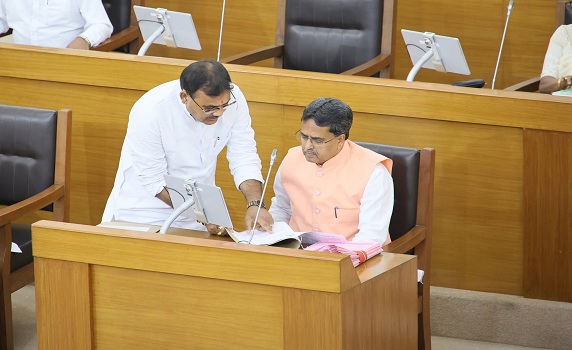 Tripura FM Pranajit Singha Roy discusses with CM Dr. Manik Saha in Assembly.